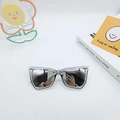 Chic cat eye sunglasses with transparent frames and dark grey lenses featuring gold accents - Silver Mirrored