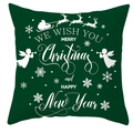 Close-up of green Christmas pillow cover with white festive reindeer and holiday text - Green White Merry Christmas
