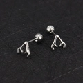 Close-up of silver antler cartilage earrings with screw ball backs on black texture - Antler / Steel