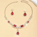 Elegant silver necklace and earrings set with red water drop crystals and small white diamonds - Red