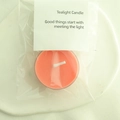 Single orange scented tealight candle in clear plastic bag with white paper header tag - Tangerine (Blood Orange)