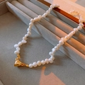 Detailed close-up of Baroque freshwater pearl necklace with golden heart magnetic clasp - Necklace - White - Style 2