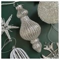 Detailed view of silver snowflake and ball ornaments on a deep green background - Ancient Silver Glitter Glass Icicles