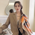Orange patterned paisley scarf hairband accessory for women paired with a beige blazer - Orange Saddle