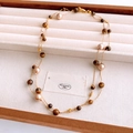 Detail of vintage double-layer necklace with tiger eye stones and pearls in a wooden box - Gold Brown