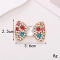 Detail shot of a crystal bow accessory with dimensions 3.6cm by 2.5cm and 8g weight - Alloy / D717 Colorful Bow Tie
