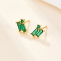 Detailed close-up of S925 silver gold-plated earrings with emerald green zircon stones - Gold Green Zirconia