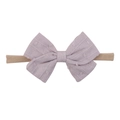 Detail of light purple macaron bow baby headband with textured dots on soft nylon strap - Light Purple