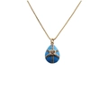 Detailed close-up of a blue enamel egg pendant with gold cross lines and colorful crystals - Blue