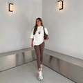 White dropped shoulder T-shirt with coffee print and brown leggings on model - S / White