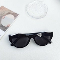 Y2K style black cat eye sunglasses with thick frames and silver metal accents - Black