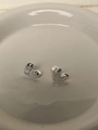 Detailed view of 925 sterling silver heart studs with textured liquid metal finish - Silver