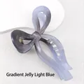 Macro shot of 13cm gradient jelly blue bow hair claw clip with smooth polished finish - Gradient Jelly Gray