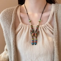 Close-up of bohemian butterfly pendant necklace with colorful beads on a wax cord strap - Colorful Butterfly Beaded Style (18#)