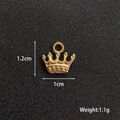 Detail of vintage gold crown pendant with dimensions 1.2cm by 1cm for DIY jewelry making - Crown