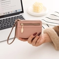 Pink lychee texture leather wristlet wallet with leaf-shaped zipper pull detail - Pink