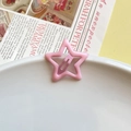Pink star-shaped metal hair clip with glossy enamel finish on a white plate background - Light Pink