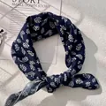 Detailed texture of navy cotton linen scarf with white floral leaf patterns and hemmed edges - XY-24 Deep Blue Leaf Floral