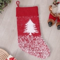 Red knit Christmas stocking with white tree pattern and fluffy snowflake details - Christmas Tree