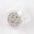 Vista macro di microsfere d'argento per nail art in varie misure in custodia rotonda - Argento