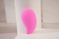 Pink teardrop beauty sponge makeup blender on a white pedestal for smooth application - Fine Pink Waterdrop
