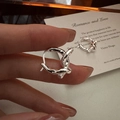 Minimalist S925 sterling silver knot hoop earrings with textured finish shown on fingers - Silver (EHZ109)