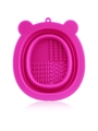 Detailed view of pink silicone makeup brush cleaner mat with multiple scrubbing textures - Rose Red