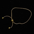 Adjustable golden snake chain bracelet with slider clasp on black velvet background - Adjustable Anklet / Gold