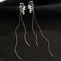 Close-up of silver butterfly earrings with white pearls and elegant long tassels - Silver Butterfly Pearl Tassel (K9865)