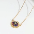 Golden sunburst Devil's Eye necklace with celestial galaxy stone and sparkling accents - Black Red