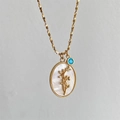 Vintage gouden ketting met ovale bloem hanger van schelp en kleine blauwe edelsteen - December-Kerstster