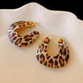 Macro detail of leopard print hoop earrings with gold plating on a white plate - 18# Leopard Print U-shaped Enamel Ear Buckles