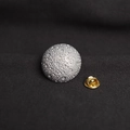 Cute cartoon moon enamel pin in silver-grey with crater texture and gold backing - Moon Design