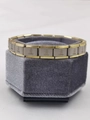 Silver and gold link bracelet featuring Courage engraving on a gray velvet stand - 0132-brave-phnom Penh 1st Section