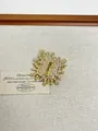 Detail of gold irregular sunburst brooch with inlaid rhinestones and white pearls - 45 Gold Keyhole (XZ0063)