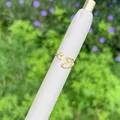Polished 18K gold-plated open heart ring with hollow design on a white display stand - Hollow Heart Style