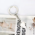 Detail view of hexagonal white crystal stone pendant keychain on a minimalist metal ring - White Crystal