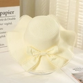 Women's cream straw sun hat with bow decoration and delicate lace trim detail - Lotus Knot Creamy White