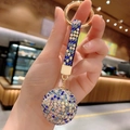 Blue and silver crystal ball keychain with gold spring hook and braided rhinestone strap - Mixed Blue