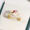 Macro view of a gold flower ring with butterfly, white shell, and pink zircon stones - Mother of Pearl Flower Butterfly with Colored Rhinestones (Gold 13)