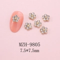 Macro shot of 7.5mm gold base five-petal flower nail charms with crystal rhinestones - Clear Rhinestone Flower (9805) / 1 Piece