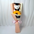 Detail of graduation bear bouquet with sunflower and pink ribbon gift wrapping - Champagne + Sunflower