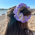 Handmade crochet ruffle hair scrunchie in lilac and beige yarn worn on hair - White with Purple Edge