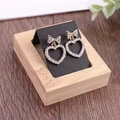 Bamboo wood 36-slot jewelry display tray with gold bow and heart-shaped stud earrings - 1 Slot - Black PU