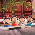 Set of four ancient Chinese style girl figurines in colorful Hanfu attire on vintage book - 1056-3 Elegant Shaking Head Set of 4