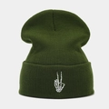 Close-up of white skeleton hand embroidery on a dark green ribbed knit beanie cap - Army Green