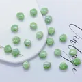 Light green shell-shaped ceramic beads with glossy finish for DIY jewelry making - 12mm / Green
