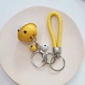 Cartoon bell keychain with yellow woven leather strap and star cutout metal bell charm - Yellow/White