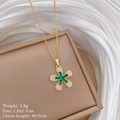Macro shot of titanium flower pendant with white crystals and green center gemstone - Five Petal Flower Full Diamond Style (D452)