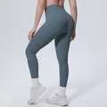 Detail der hoch taillierten nahtlosen Yoga-Leggings mit Push-up-Effekt und Bauchkontrolle - S / Ölblau